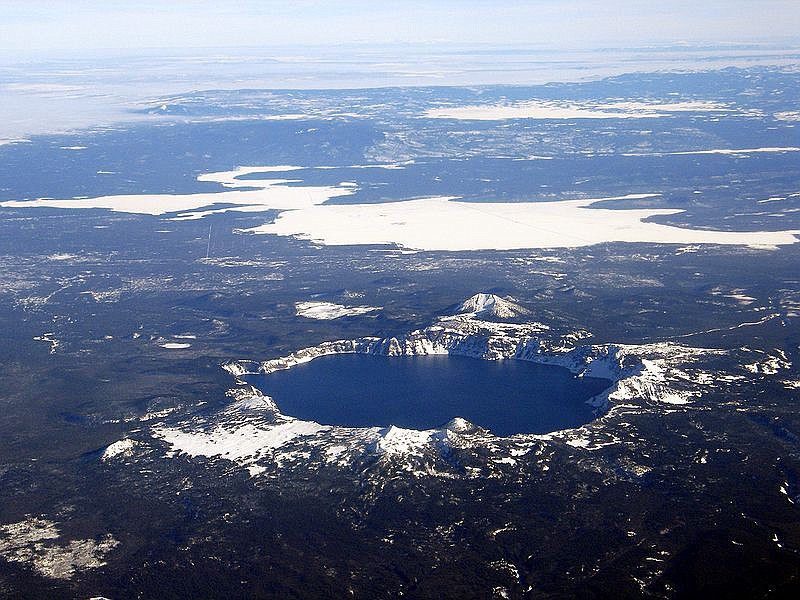 This is an aerial view of Crater Lake, Wizard Island, and Mount Scott, as seen from the west. (USGS photograph taken on December 10, 2005, by Mike Doukas.)
