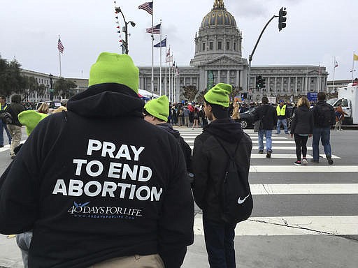 In this Saturday, Jan. 21, 2017 file photo, anti-abortion demonstrators gather at San Francisco City Hall for the 13th annual Walk for Life West Coast march. The collapse of the Republican health care overhaul in March 2017 was a sharp setback for anti-abortion leaders, whose hopes of halting federal funding to Planned Parenthood were derailed. But they continue to pursue that goal and also are pushing for a federal ban on most abortions after 20 weeks of pregnancy. 