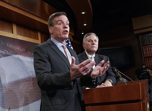 Senate Intelligence Committee Vice Chairman Sen. Mark Warner, D-Va., left, with Committee Chairman Sen. Richard Burr, R-N.C., speaks during a news conference on Capitol Hill in Washington, Wednesday, March 29, 2017, to discuss their panel's investigation of Russian interference in the 2016 election. 