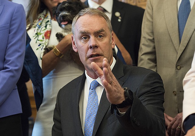 Interior Secretary Ryan Zinke speaks Wednesday at the Interior Department in Washington after signing an order lifting a moratorium on new coal leases on federal lands and a related order on coal royalties.