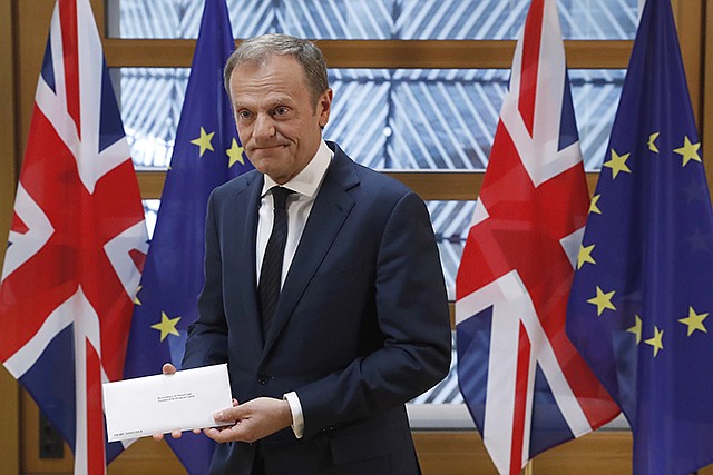EU Council President Donald Tusk holds British Prime Minister Theresa May's Brexit letter  Wednesday, which was delivered by Britain's permanent representative to the European Union Tim Barrow that gives notice of the UK's intention to leave the bloc under Article 50 of the EU's Lisbon Treaty, in Brussels, Belgium. Barrow hand-delivered the letter signed by May that will formally trigger the beginning of Britain's exit from the European Union.
