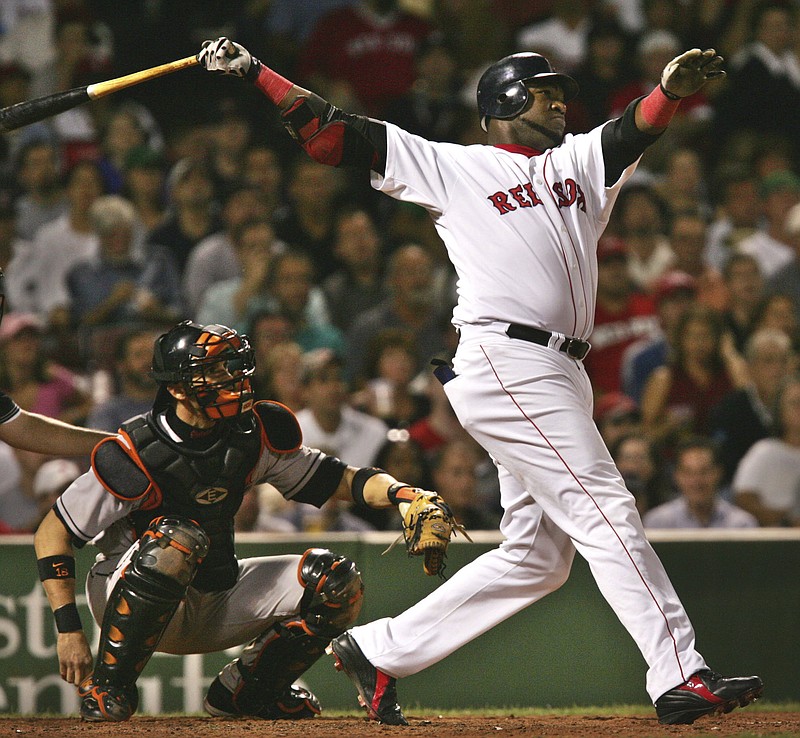 In this Sept. 22, 2004, file photo, Boston Red Sox's David Ortiz watches the flight of his two run, home run off Baltimore Orioles starter Sidney Ponson, in the seventh inning at Fenway Park in Boston. Ortiz appeared in more than 2,000 career games as a designated hitter, but Big Papi's retirement after last season takes away one of few remaining players whose primary job is to hit. 