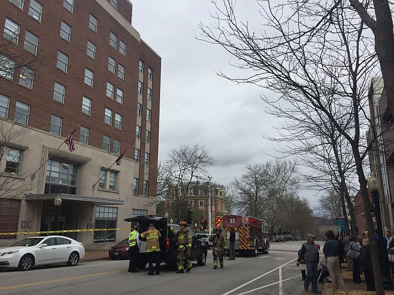 Emergency personnel respond to a report of smoke inside the Governor Office Building on Madison Street on March 30, 2017, as evacuated workers stand by.