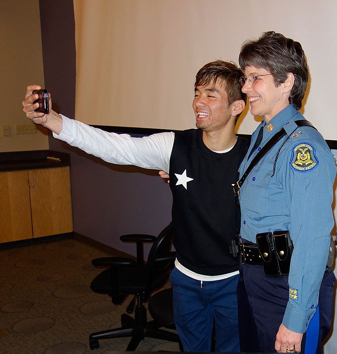 Col. Sandy Karsten, superintendent of the Missouri State Highway Patrol, poses for a selfie with a student at Westminster College during a visit Wednesday.