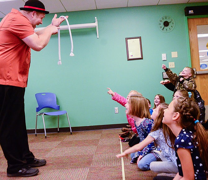 Children in the audience of Joshua Routh's "Build a Better Story" show try and figure out his rope trick Wednesday. Routh entertained a room full of children during the Callaway County Library event.