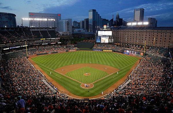 In this May 11, 2015, file photo, the Blue Jays and Orioles play in the fourth inning of a game in Baltimore. It's been 25 years since the Orioles began playing in Camden Yards, the start of a nationwide trend of major league teams moving into new ballparks.