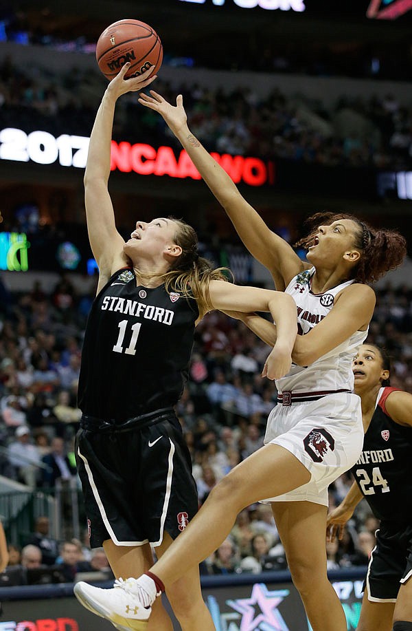 Stanford forward Alanna Smith and South Carolina forward Mikiah Herbert Harrigan reach for a rebound during the first half of Friday's semifinal game of the women's Final Four in Dallas.