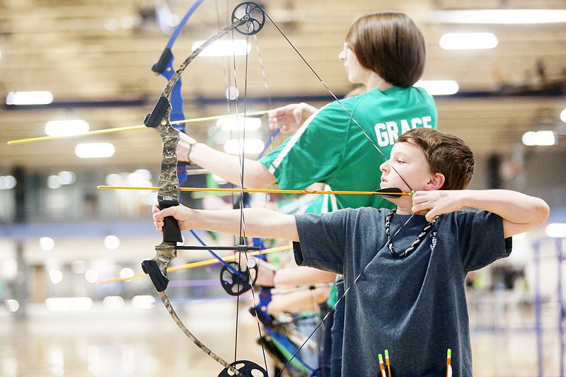 First-year archer Austin Nilges, 9, shoots during a state archery tournament Saturday at The LINC on the Lincoln University campus in Jefferson City.