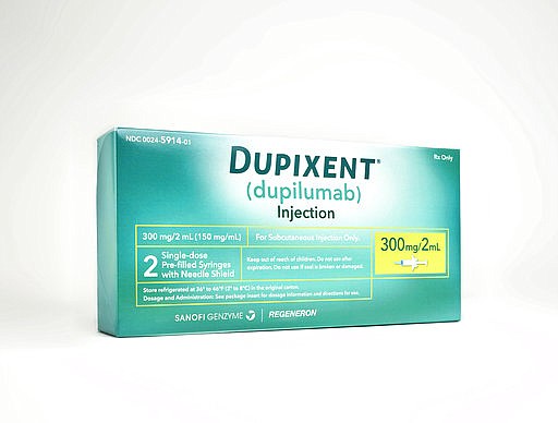 This image provided by Sanofi shows a box containing two single-dose pre-filled syringes of the drug Dupixent. On Tuesday, March 28, 2017, the Food and Drug Administration approved Dupixent for moderate or severe eczema, which causes red, fiercely itchy rashes on the face, arms and legs. 