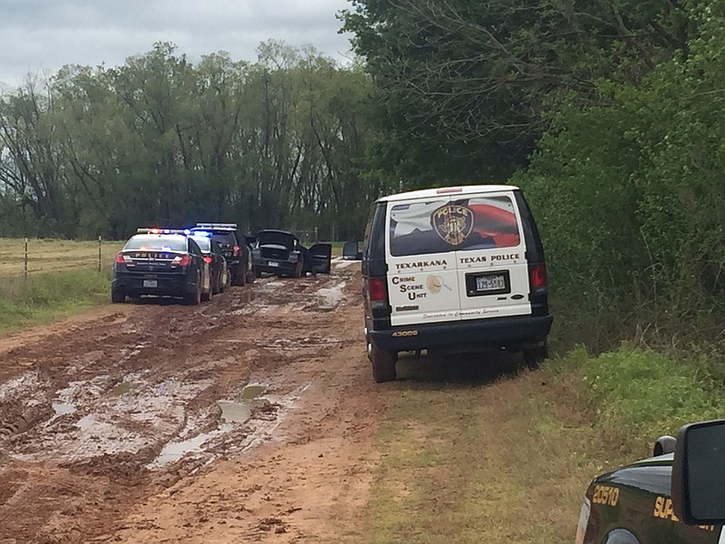 Texarkana, Texas, police process the scene where a suspect was arrested in Wednesday morning, April 5, 2017, in the robbery of Bank of the Ozarks on Richmond Road. The suspect led police on a brief chase north down Richmond before he was arrested.