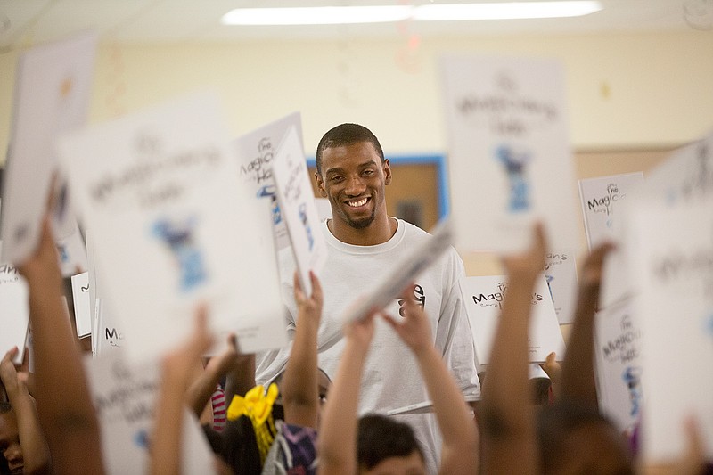 Malcolm Mitchell, wide receiver for the New England Patriots, talks with the students Thursday at Theron Jones Early Literacy Center. Mitchell was in Texarkana to tell students about the importance of reading and to develop a love for reading in all children through the initiative Reading with Malcolm.