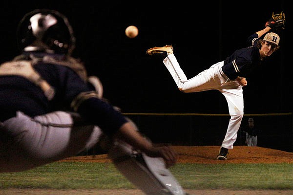 Helias pitcher Tyler Cassmeyer follows through on his delivery during Thursday's game against Blair Oaks in the Capital City Invitational at the American Legion Post 5 Sports Complex. Cassmeyer and Trevor Austin combined for a no-hitter in Helias' 5-1 win.
