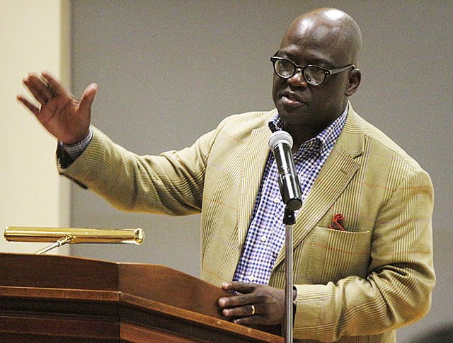 Dr. Benjamin Ola. Akande speaks following dinner Friday at the Faith Voices annual dinner at Lincoln University. Akande gave his perspective on race relations, how they've changed since the civil rights movement and where they are headed.