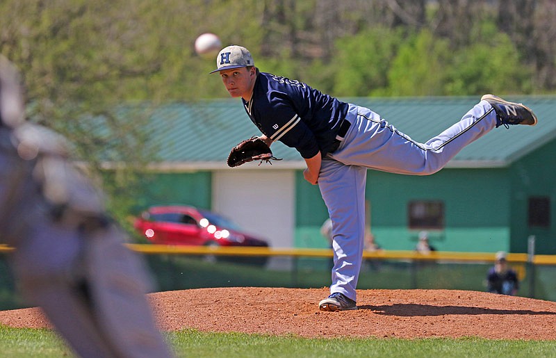 Zach Davidson of Helias watches his pitch Saturday, April 8, 2017 during the championship game of the Capital City Invitational against Jefferson City at Vivion Field.