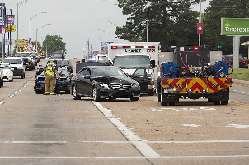 Three cars were involved in a series of wrecks Monday on State Line Avenue. A blue Pontiac hit a stationary black Mercedes-Benz, which in turn hit a gray Ford. No one was injured, and the driver of the Pontiac was cited, authorities said.