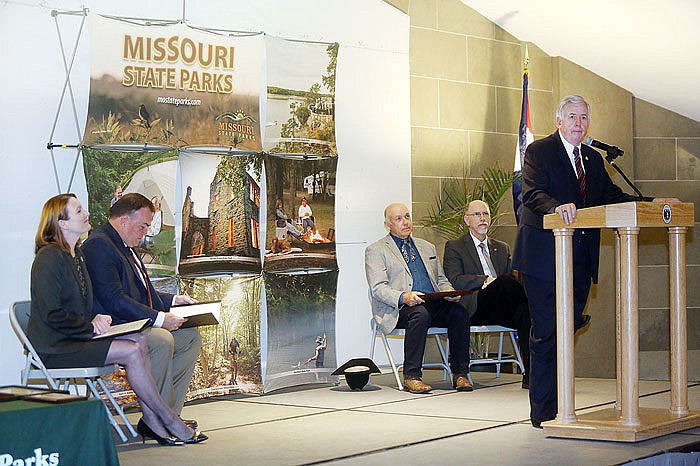 Lt. Gov. Mike Parson, right, speaks during a Monday celebration of the centennial of Missouri's state park system at the Capitol. The celebration featured speakers discussing the history of the park and its patrons.