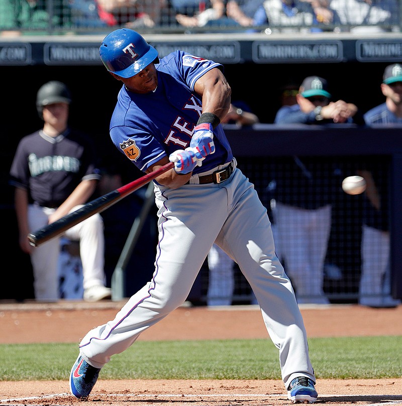In this Monday, March 6, 2017, photo, Texas Rangers' Adrian Beltre hits during the first inning of a spring training baseball game against the Seattle Mariners in Peoria, Ariz. Beltre goes into his 20th major league season only 58 hits shy of joining the 3,000 club. He was a .300 hitter again last year, when he also won his fifth Gold Glove. 