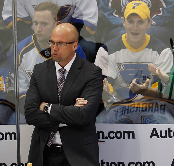 In this March 31 file photo, Blues head coach Mike Yeo looks on during the first period of a game against the Avalanche in Denver. The first-round opponent in the playoffs for the Blues is the Wild, which fired Yeo during the 2015-16 season.