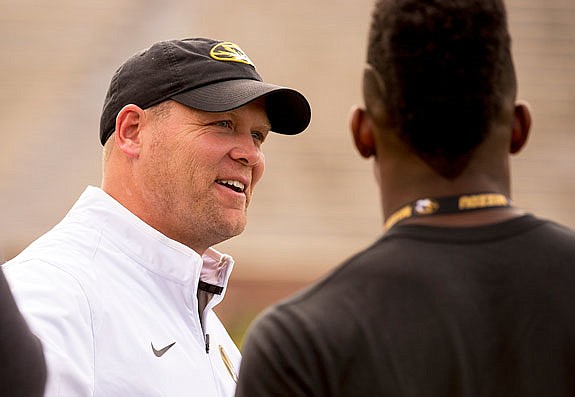 Missouri head coach Barry Odom talks to players before last year's spring game at Faurot Field.