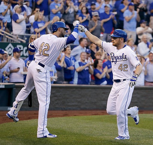 Kansas City Royals' Brandon Moss, right, celebrates with Paulo Orlando after hitting a solo home run during the fourth inning of a baseball game against the Los Angeles Angels, Saturday, April 15, 2017, in Kansas City, Mo.