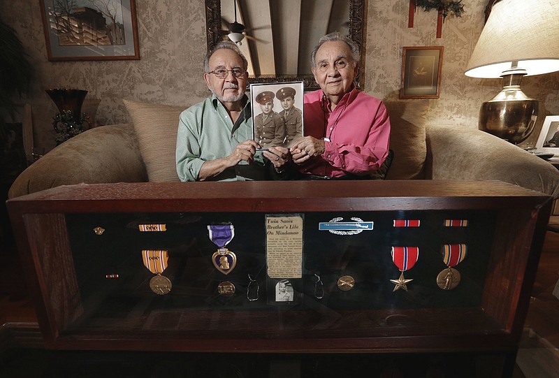 World War II veteran twin brothers Luis Manuel  Santoscoy, and Manuel Luis  Santoscoy talk about their participation in the Pacific theater during World War II, on April 14, 2017 in El Paso, Texas.  Though some of their memories are not as sharp, the twins, who celebrated their 92nd birthdays Wednesday in El Paso, found their adventure  perilous at times, in the service