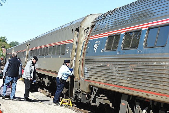 Amtrak customers board a train in 2017 at the station in Jefferson City.