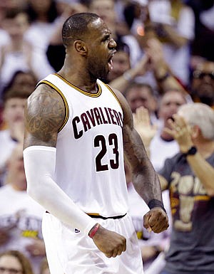 LeBron James of the Cavaliers celebrates after scoring a basket during Saturday's game against the Pacers in Cleveland.