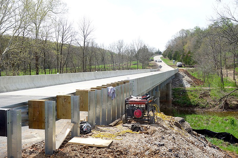 The newly resurfaced bridge over Crow's Fork Creek on Route UU is now open to two lanes of traffic, although workmen may still be present collecting equipment.