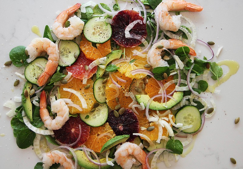 This April 8, 2017 photo shows an orange and cucumber salad with shrimp in Coronado, Calif. This dish is from a recipe by Melissa d'Arabian. 