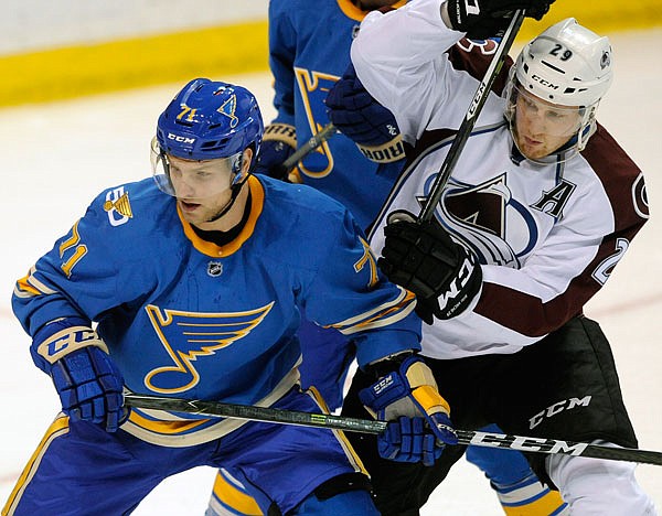 Blues' Vladimir Sobotka defends against Avalanche's Nathan MacKinnon during a game April 9 in St. Louis. 