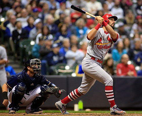 Matt Carpenter of the Cardinals watches his solo home run during the fifth inning of Thursday night's game against the Brewers in Milwaukee.