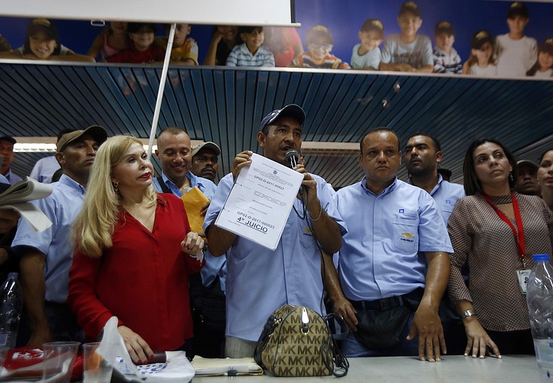 Adan Tortolero, member of General Motors's Workers Union, addresses employees at the company's plant in Valencia, Venezuela, Thursday, April 20, 2017. General Motors announced that it was shuttering operations in the country after authorities seized the factory on Wednesday. General Motors' announcement comes as Venezuela's opposition looks to keep up pressure on President Nicolas Maduro, taking to the streets again Thursday after three people were killed and hundreds arrested in the biggest anti-government demonstrations in years. 