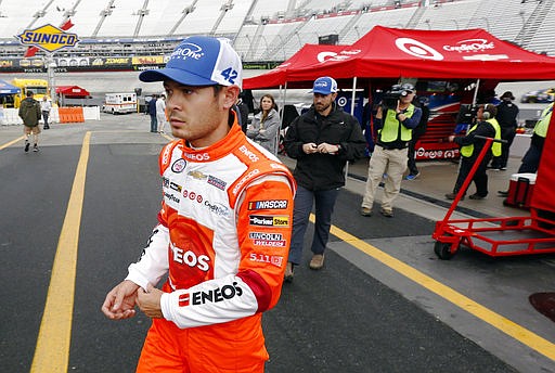 Driver Kyle Larson walks through the pit area after the first practice for a NASCAR Monster Energy NASCAR Cup Series auto race, Saturday, April 22, 2017, in Bristol, Tenn. Larson will start on the pole for Sunday's race.