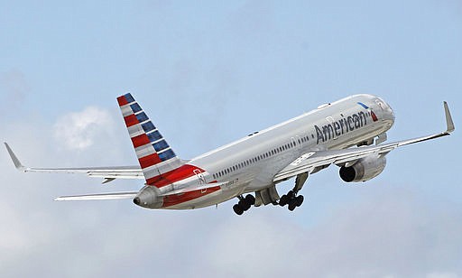 In this Friday, June 3, 2016 file photo, an American Airlines passenger jet takes off from Miami International Airport in Miami. 