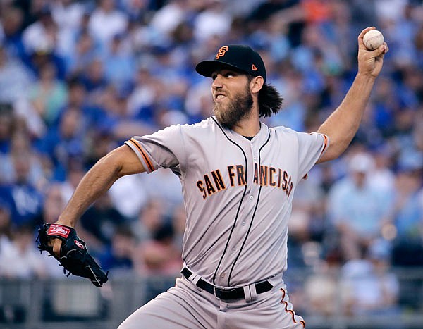 Giants starting pitcher Madison Bumgarner throws during the first inning of Wednesday's game against the Royals in Kansas City.