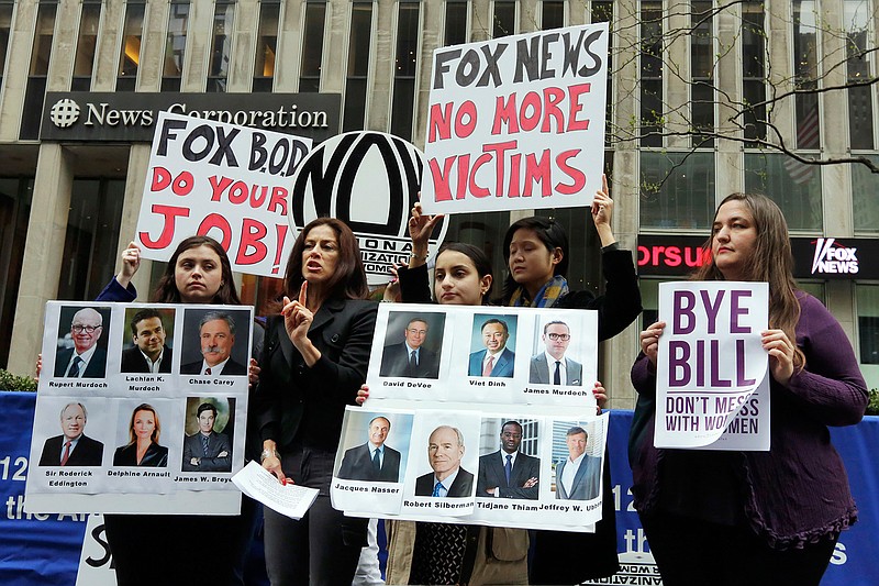 Sonia Ossorio, second left, president of the National Organization for Women New York, speaks outside the News Corporation headquarters, in New York, Thursday, April 20, 2017, a day after Fox News Channel's Bill O'Reilly was fired. The firing came on the heels of a New York Times report on April 1, that five women had been paid a total of $13 million to keep quiet about their disturbing encounters with O'Reilly.