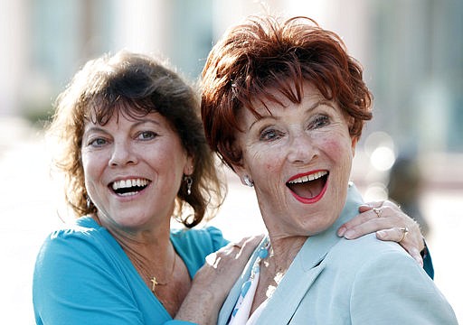 In this June 18, 2009 file photo, actresses Erin Moran, left, and Marion Ross pose together at the Academy of Television Arts and Sciences' "A Father's Day Salute to TV Dads" in the North Hollywood section of Los Angeles. Moran, the former child star who played Joanie Cunningham in the sitcoms "Happy Days" and "Joanie Loves Chachi," has died at age 56. 