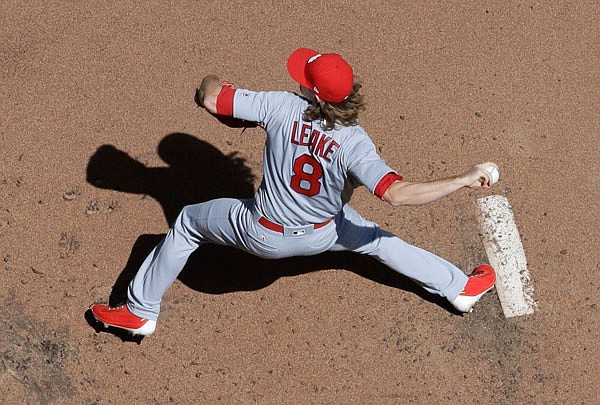 Cardinals starting pitcher Mike Leake throws during the first inning of Sunday afternoon's game against the Brewers in Milwaukee. Leake improved to 3-1 this season in the Cardinals' 6-4 win.