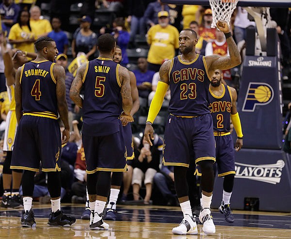 Cavaliers forward LeBron James reacts after hitting a free throw in the closing seconds in Game 4 of an Eastern Conference first-round playoff series against the Pacers on Sunday in Indianapolis. Cleveland defeated Indiana 106-102 and won the series 4-0.