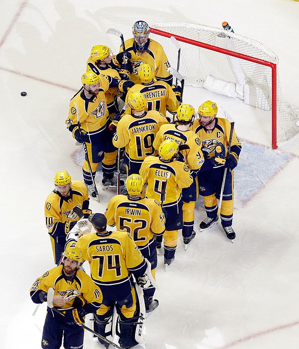 Predators players celebrate after beating the Blackhawks in Game 4 of a Western Conference first-round playoff series Friday in Nashville, Tenn.