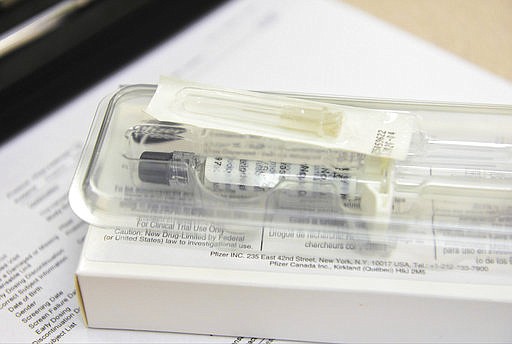 This Wednesday, March 29, 2017 photo shows a syringe involved in an experimental non-opioid pain medication trial at the Altoona Center for Clinical Research in Altoona, Pa. With about 2 million Americans hooked on opioid painkillers, researchers and drug companies are searching for less addictive drugs to treat pain. 
