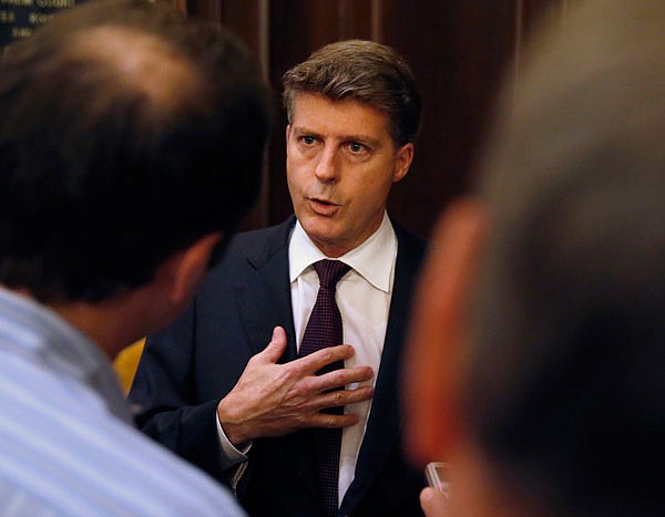 In this Nov. 16, 2016, file photo, Yankees owner Hal Steinbrenner talks with reporters during the baseball owners meetings at the Drake Hotel in Chicago. The Dodgers and the Yankees are cutting payroll and their luxury tax bills, just as Bryce Harper, Manny Machado and perhaps Clayton Kershaw near the free-agent market after the 2018 season.