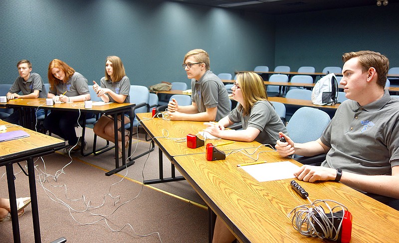 Members of South Callaway High School's quiz bowl team focus intently on their coach, Leah Cave, during a practice. This week, Austin Clubb, left, Zoe Cook, Ember Atkins, Kendall Evans, Jessica Buckner and Thomas Dillon will compete in both sectionals and nationals.