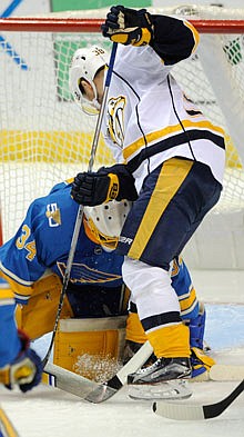 Blues goalie Jake Allen blocks a shot by Victor Arvidsson of the Predators during a game earlier this month in St. Louis.