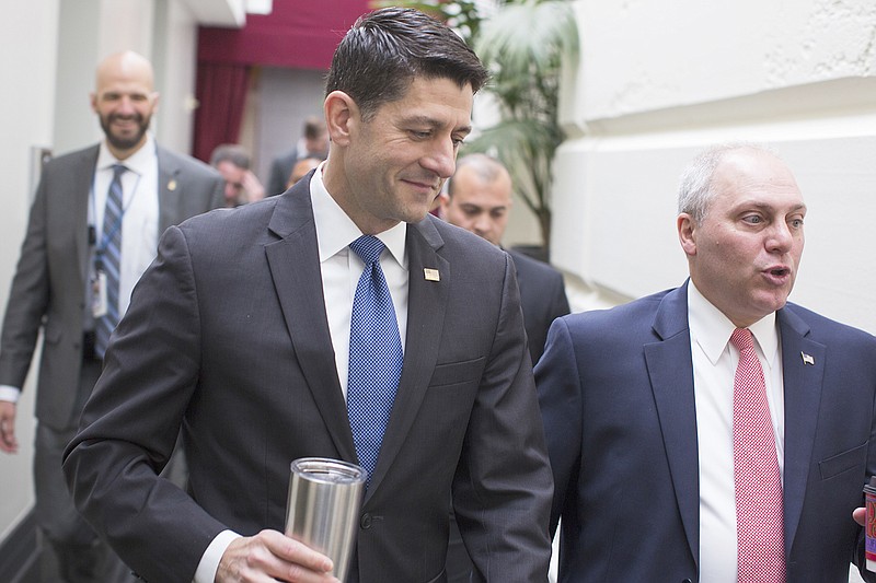 House Speaker Paul Ryan, of Wisconsin, left, talks with House Majority Whip Steve Scalise, of Louisiana, as they arrive Wednesday for a GOP caucus meeting on Capitol Hill in Washington.