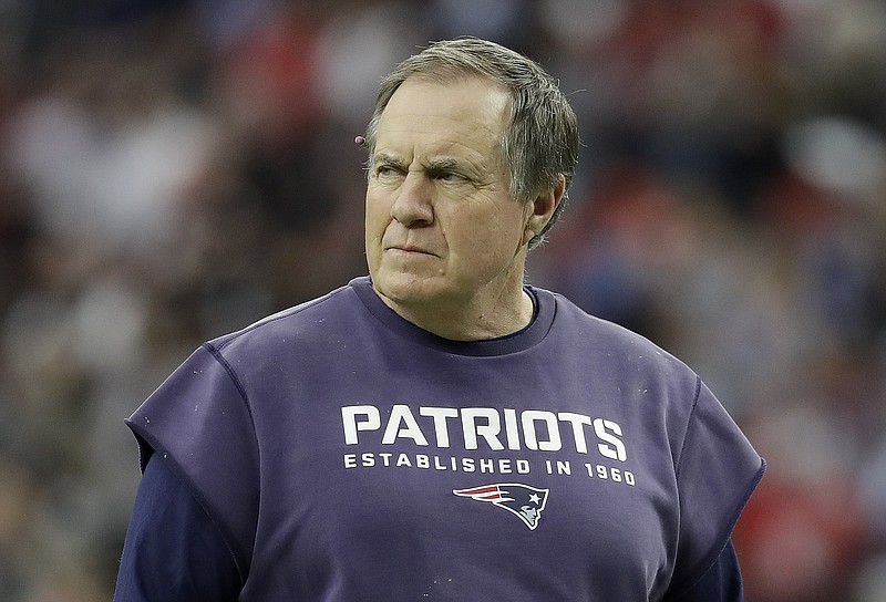 In this photo taken Feb. 5, 2017, New England Patriots head coach Bill Belichick watches during warm ups before the NFL Super Bowl 51 football game against the Atlanta Falcons in Houston. If the Patriots are the NFL's model franchise, maybe the rest of the league needs to take a closer look at how Belichick and Co. have gone about constructing their roster, especially when it comes to the draft. These are the basic tenets: stockpile picks; go relatively heavy on defense and offensive line; go light on skill positions; when you find a starter, keep him. 