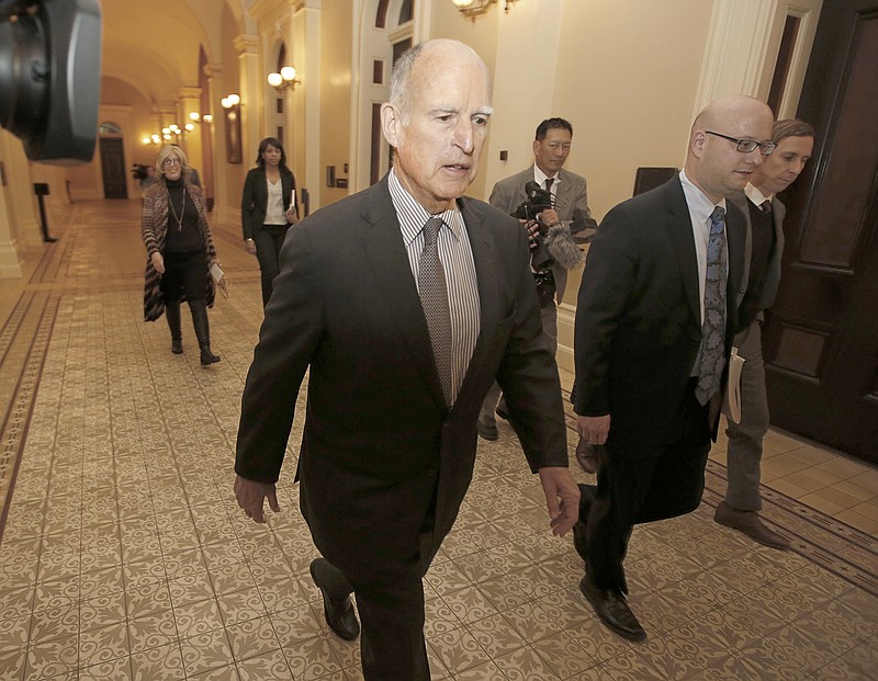 California Gov. Jerry Brown returns to his office April 6 after a meeting in Sacramento. Brown and the California Legislature are among this year's winners of the Jefferson Muzzles, satiric awards bestowed by a free speech group for what it considers egregious offenses. Brown and legislators passed a law banning online employment databases from listing the ages of actors and actresses. The Charlottesville, Virginia-based Thomas Jefferson Center for the Protection of Free Expression announced its awards Thursday.