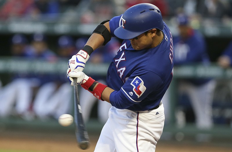 Texas Rangers designated hitter Shin-Soo Choo of South Korea makes contact on a foul all during a baseball game against the Minnesota Twins in Arlington,Texas, Wednesday, April 26, 2017. 