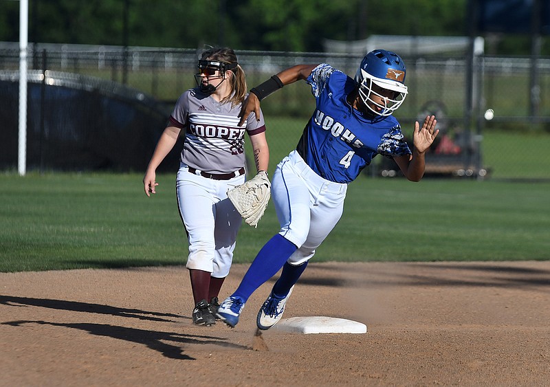 Hooks' Marena Estell rounds second base during a bi-district playoff game against Cooper on Thursday at Northeast Texas Community College.