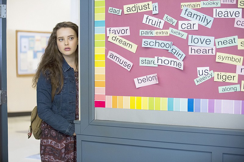 This image released by Netflix shows Katherine Langford in a scene from the series, "13 Reasons Why," about a teenager who commits suicide. The stomach-turning suicide scene has triggered criticism from some mental health advocates that it romanticizes suicide and even promoted many schools across the country to send warning letters to parents and guardians. The show's creators are unapologetic, saying their frank depiction of teen life needs to be "unflinching and raw."